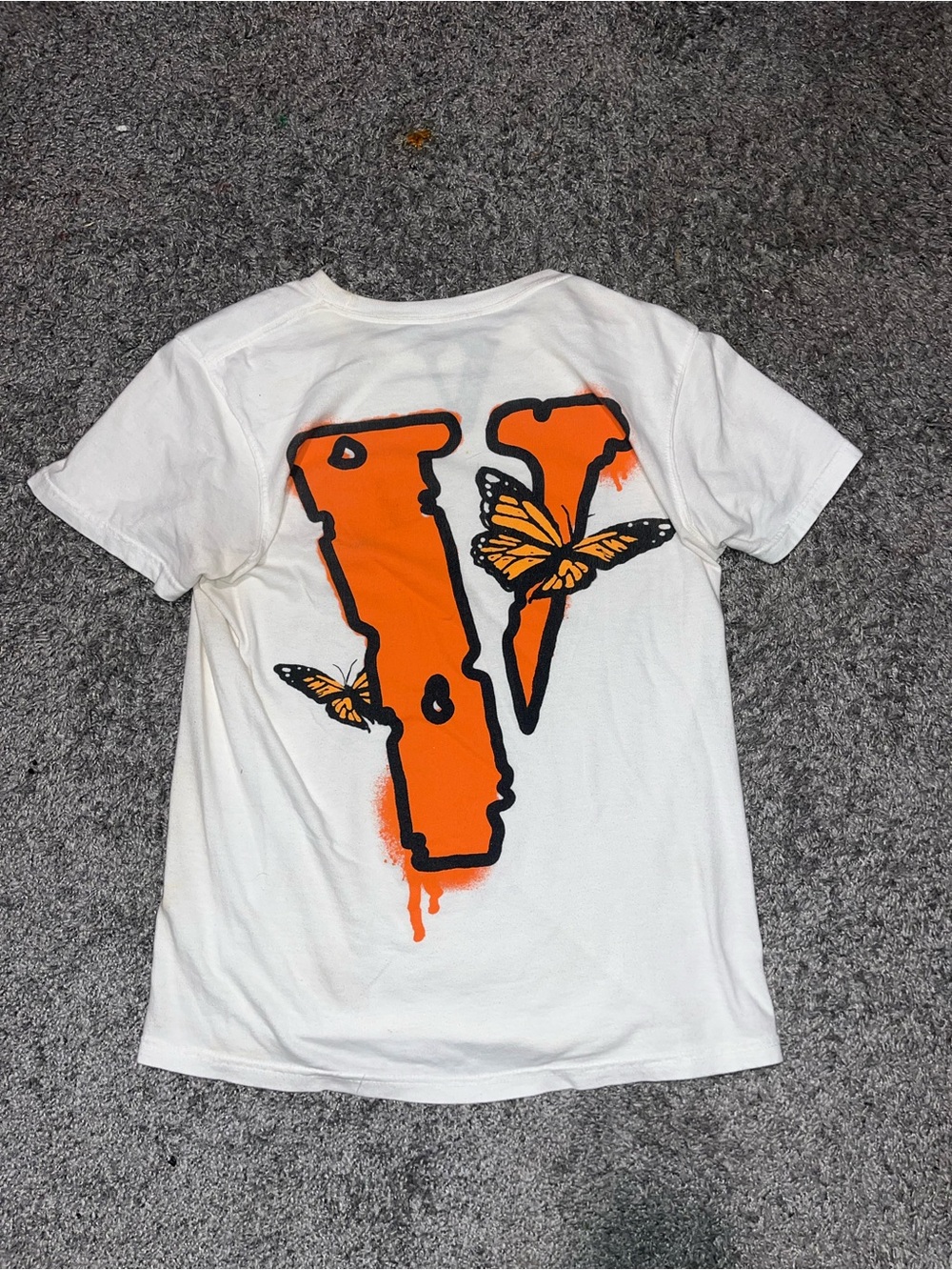 White juice Wrld Tee with Orange 'V' and Butterfly Graphic